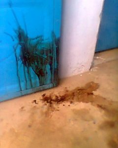 Blood on the floor and wall of the Mosque
