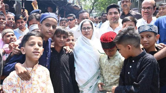 WB CM Mamata Banerjee posing for selfies with children at an Eid event in Kolkata