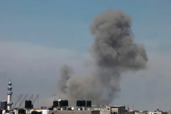 Smoke billows during Israeli strikes on Rafah, April 9 [Mohamed Abed/AFP]